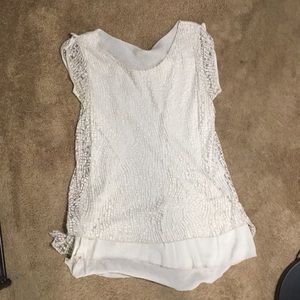Split back and sheer cream tank